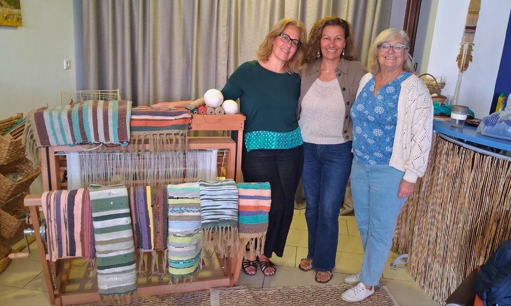 Members of CRMA feeling proud of our first batch of rag rugs crafted with recycled materials.